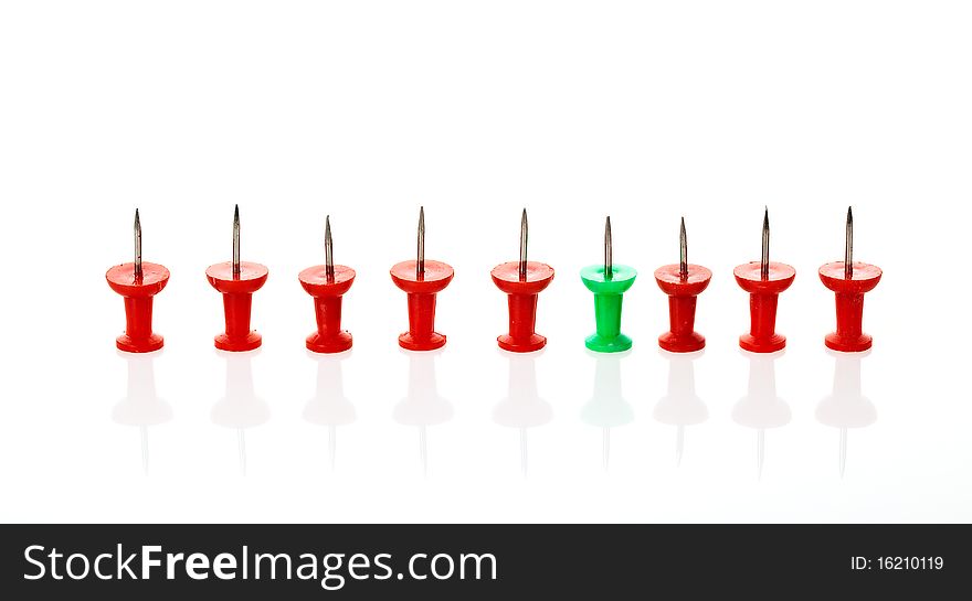 Colorful pins in a row isolated on a white background. Colorful pins in a row isolated on a white background