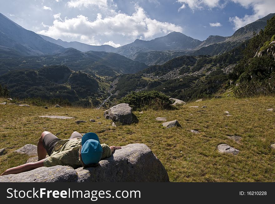 Young Woman relaxing in the Pirin mountains in Bulgaria. Young Woman relaxing in the Pirin mountains in Bulgaria