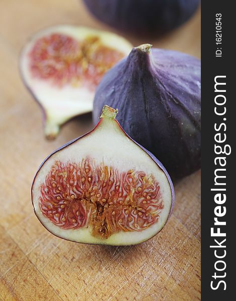 Fresh figs on the wooden background