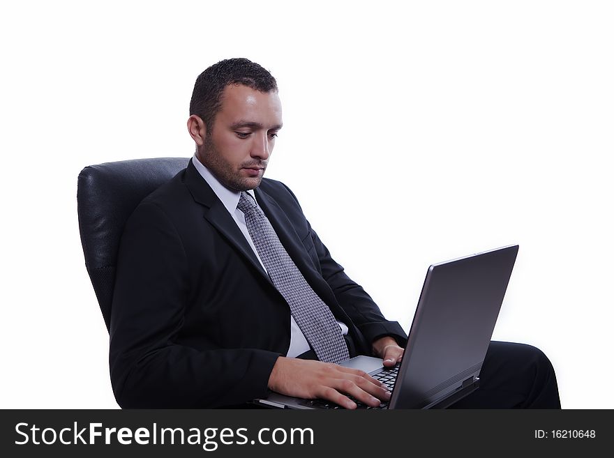 Successful businessman in his chair, with laptop, working, isolated on white. Successful businessman in his chair, with laptop, working, isolated on white