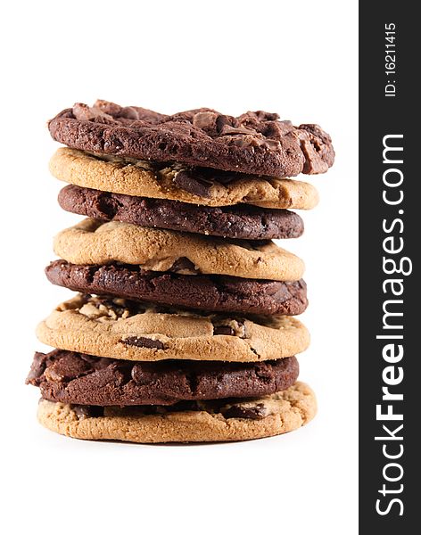 Stack of mixed double chocolate and chocolate chip cookies against a white isolated background. Stack of mixed double chocolate and chocolate chip cookies against a white isolated background.