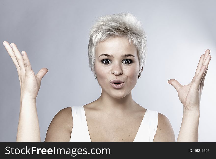 Portrait of an attractive teenage girl on grey background