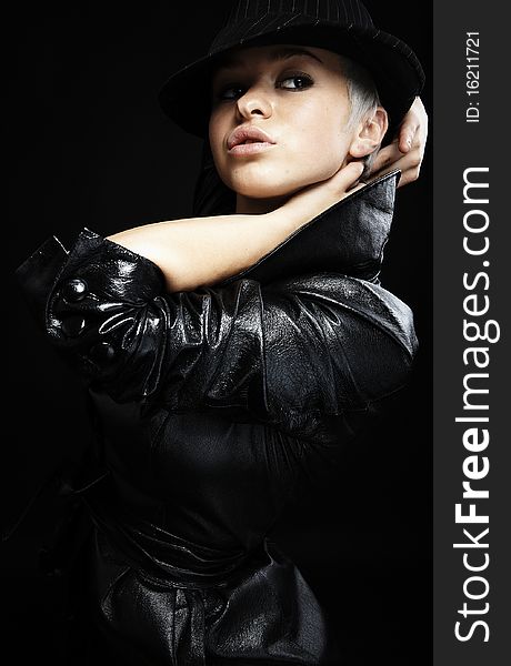 Portrait of attractive teenage girl in leather jacket & hat