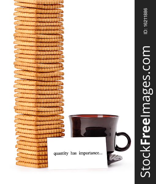 A cup of coffee with a mountain of cookies and a note quantity has importance on a white background. A cup of coffee with a mountain of cookies and a note quantity has importance on a white background
