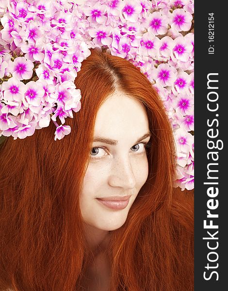 The image of a beautiful girl with flowers in her hair