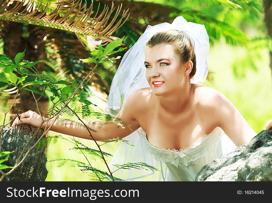 Beautiful young bride on the tropical beach