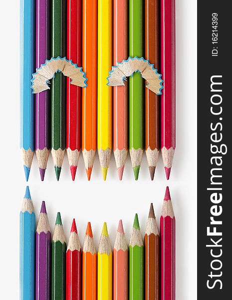 Color pencils formation that looks like smiling expression. Color pencils formation that looks like smiling expression