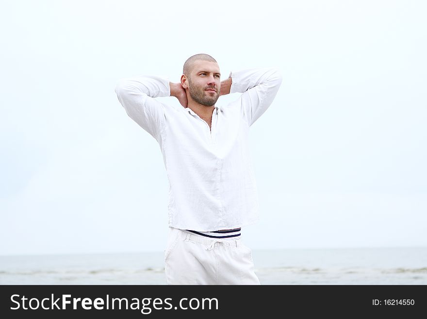 Attractive and happy man on beach