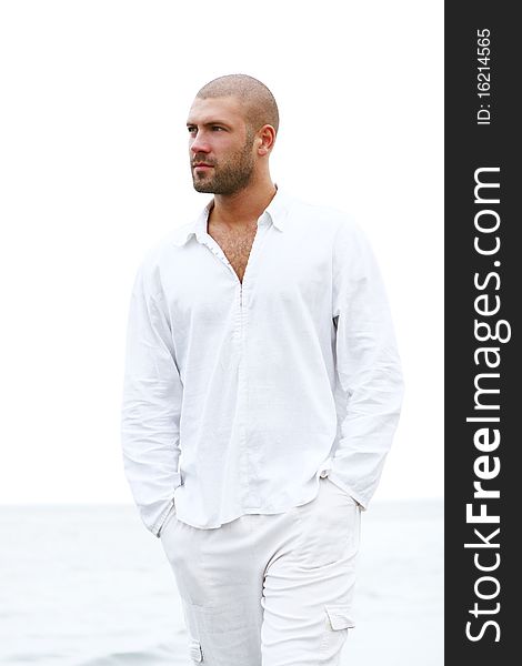 Attractive and happy man on the beach