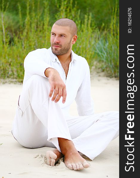 Attractive and happy man on beach