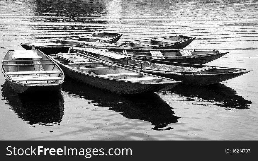 Vietnamese wooden row boats from transferring the tourists in the river. Vietnamese wooden row boats from transferring the tourists in the river