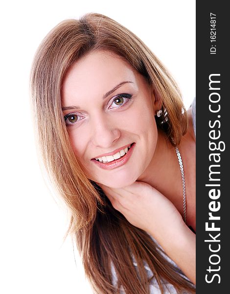 Closeup portrait of cute young girl smiling against white background