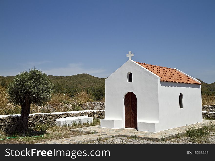 Traditional white greek chapel in Rhodes Greece