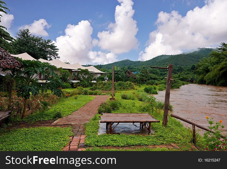 Oriental resort near a river in the jungle , image was taken in Thailand