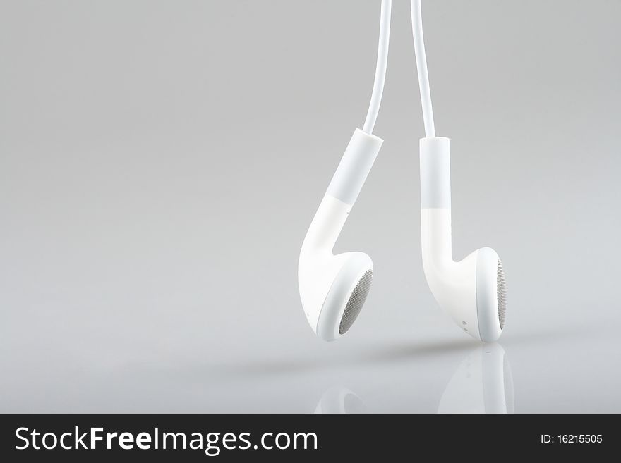 Macro with white earphones isolated