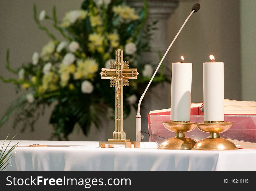 Altar in the church with candles and cross