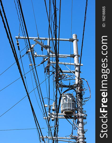 Electric transformer on blue sky