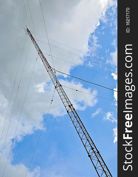 Antenna with blue sky and white cloud