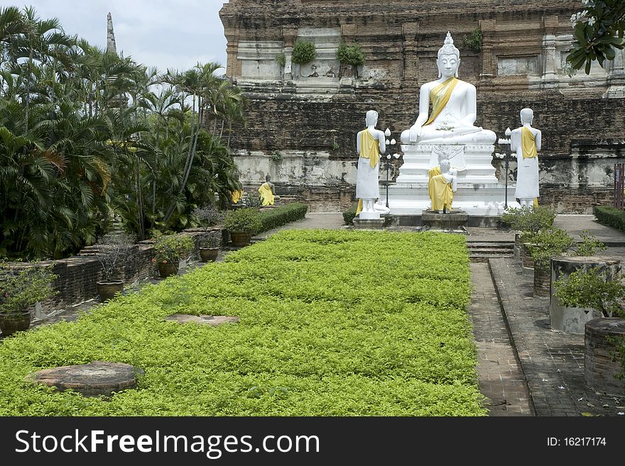 White Buddha in Wat Yai chai Mong kol , Ayutthaya , Thailand. White Buddha in Wat Yai chai Mong kol , Ayutthaya , Thailand.