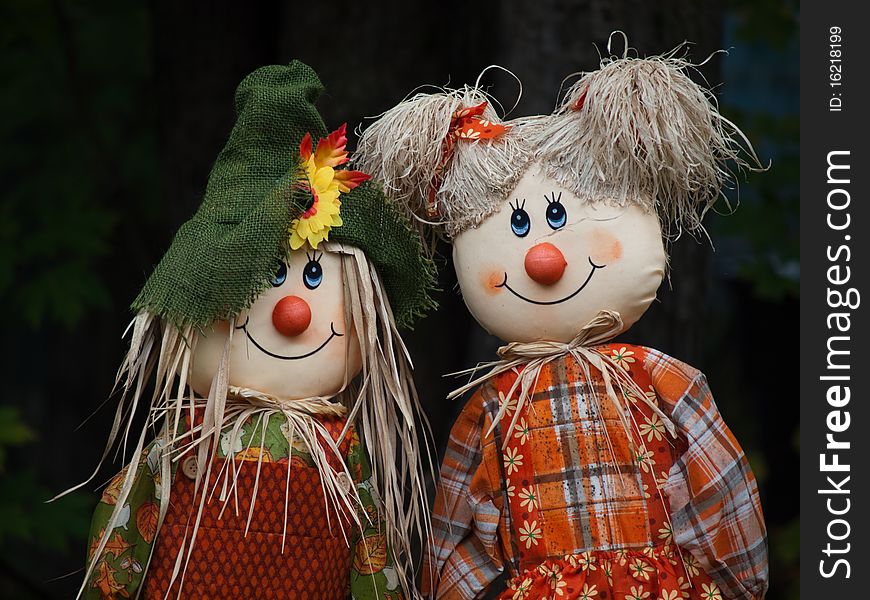 Two scarecrow dolls side by side