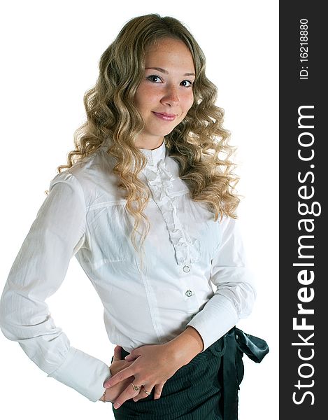 The young beautiful girl in a white shirt and black skirt. Isolation on a white background