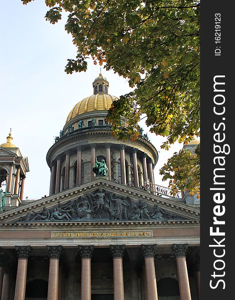 Cathedral of st. Isaak , St. Petersburg, Russia with trees in the foreground.