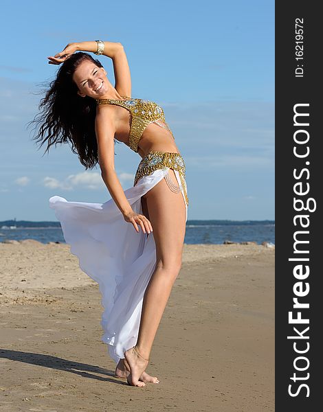 Graceful woman in white exotic dress. Graceful woman in white exotic dress