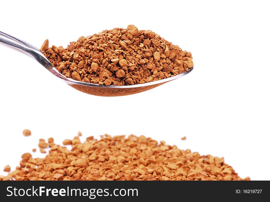 One teaspoon of instant coffee granules isolated on white background. One teaspoon of instant coffee granules isolated on white background