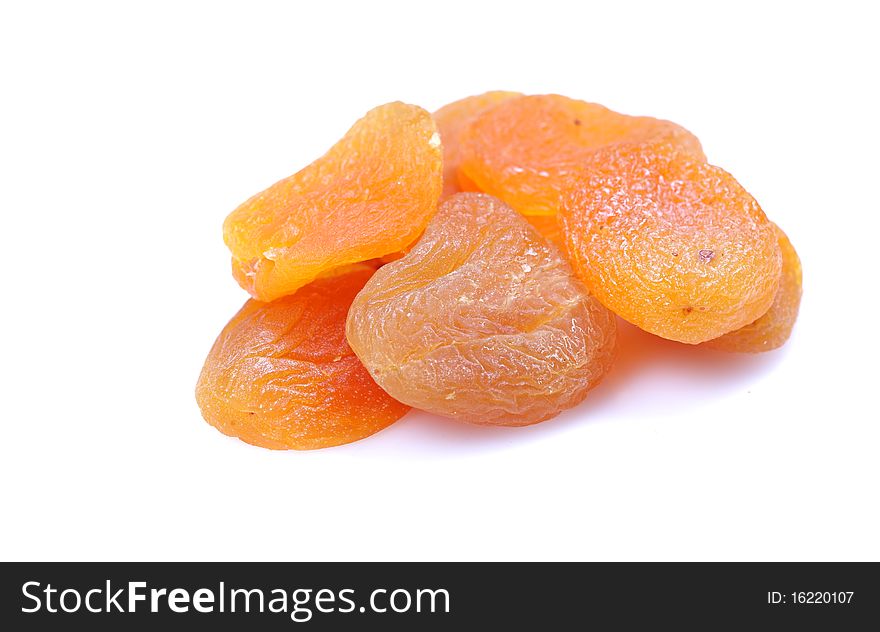 Dry peaches isolated on white background.