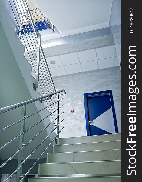 White stairway with steel railings. White stairway with steel railings