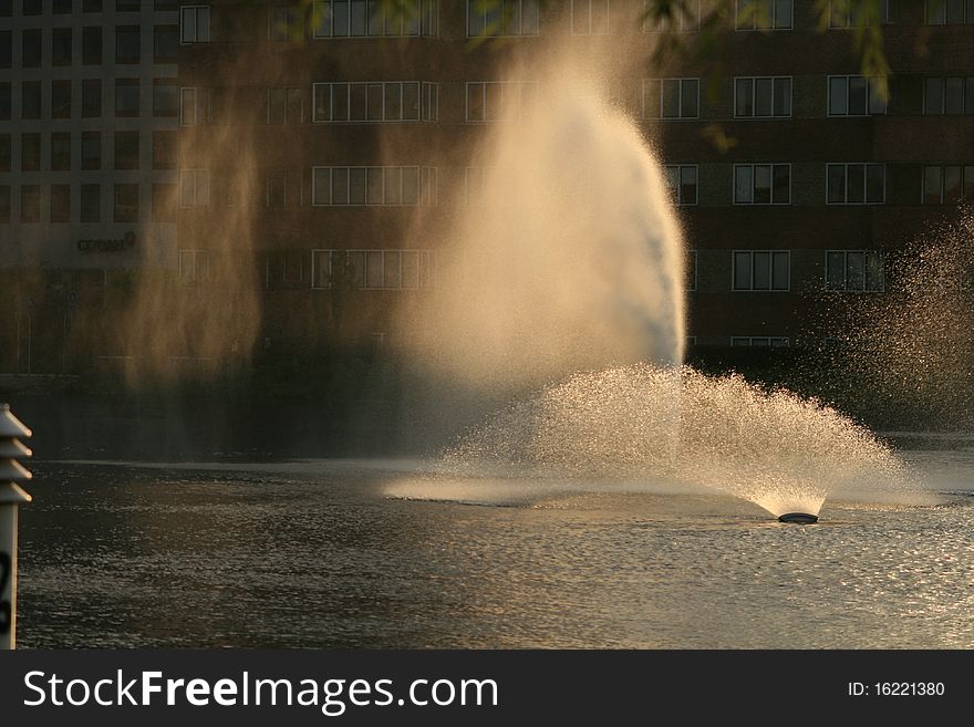 Sunset lights over fountain jets in copenhague. Sunset lights over fountain jets in copenhague