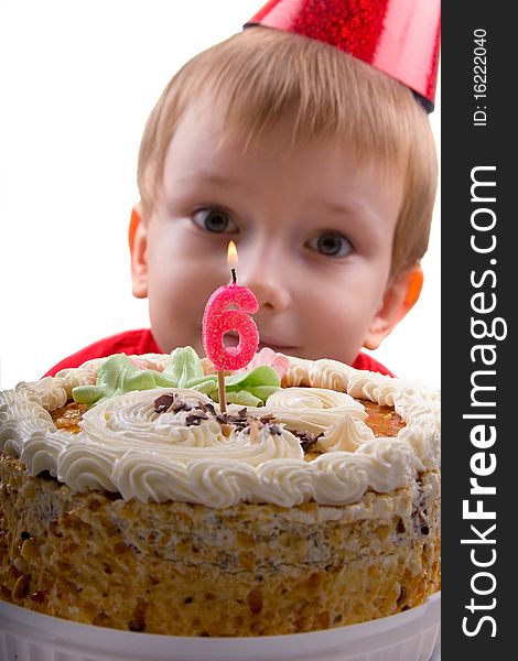 Happy boy with a cake on a white background