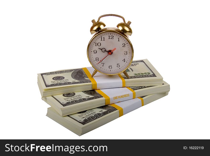 Alarm clock on stack of dollar isolated on a white background