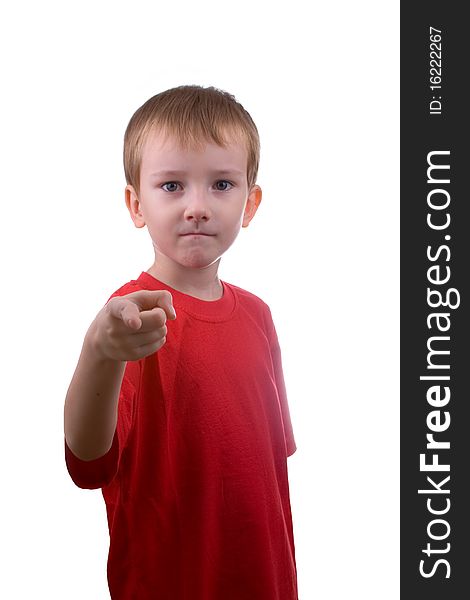 Boy shows his finger forward on a white background