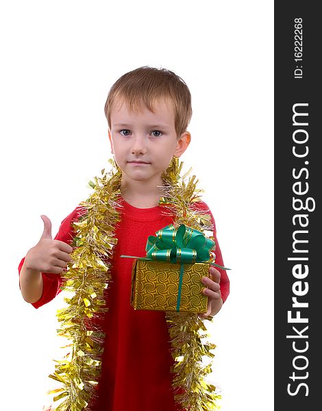 Happy boy with a gift shows the sign of OK, isolated on a white background. Happy boy with a gift shows the sign of OK, isolated on a white background