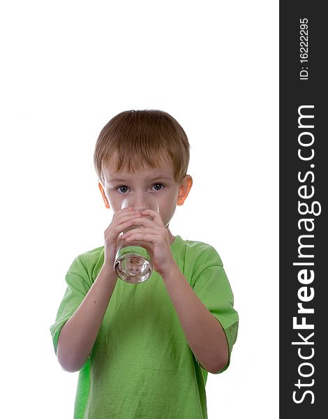 Boy drinks water from a glass