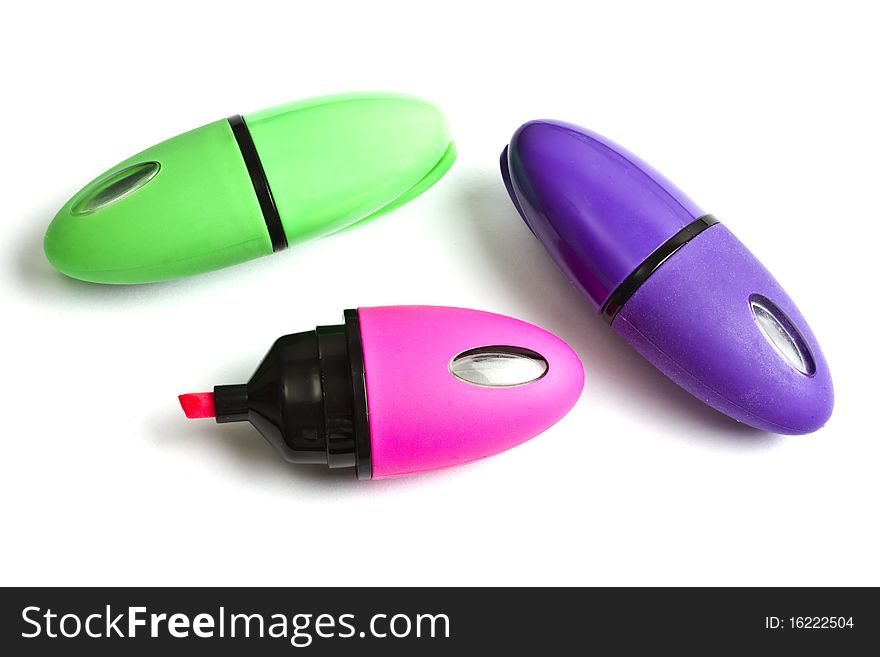 Three mini colorful highlighters isolated on white background