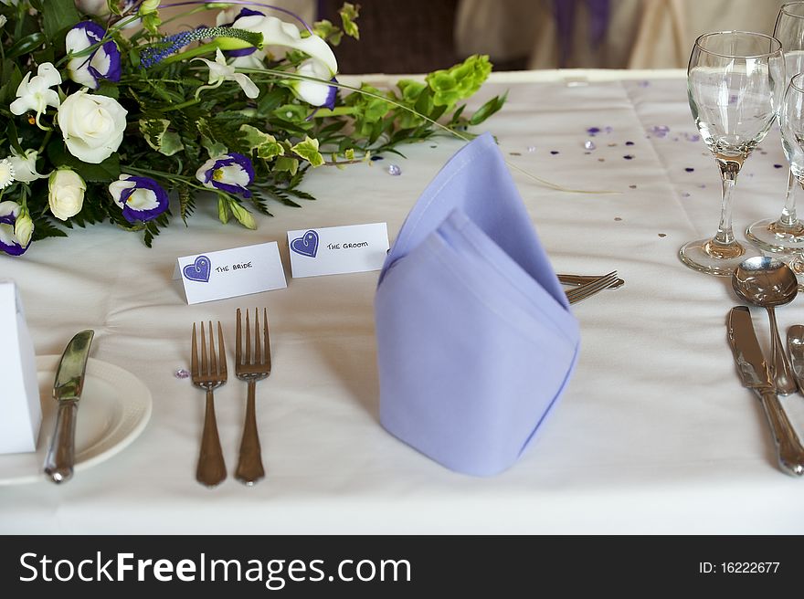 Table setting at wedding breakfast with bride and groom tags