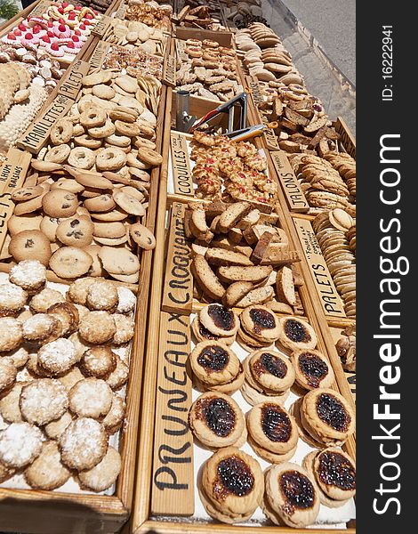 Pastry and biscuits on table, market-place in France