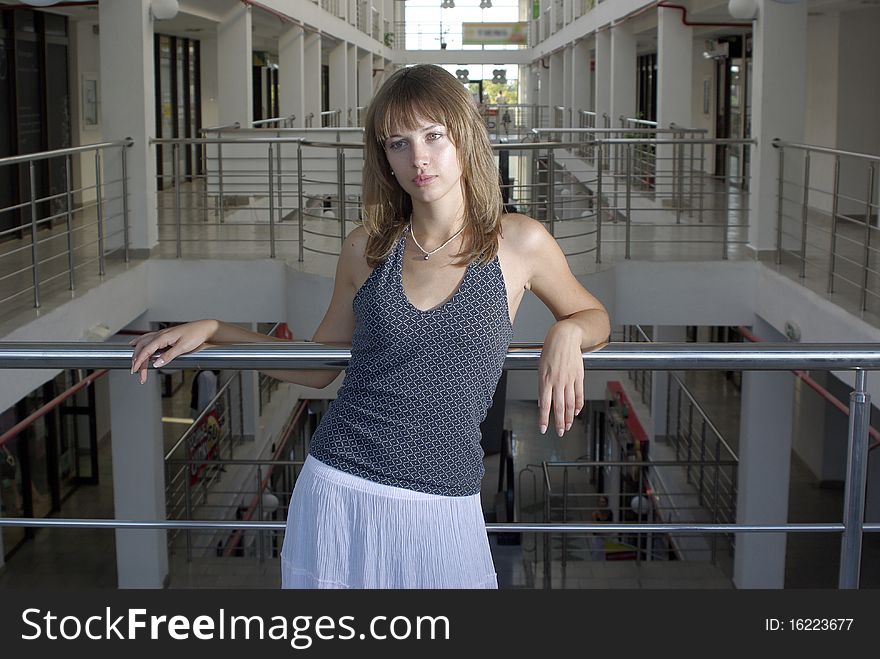 Beaty in a supermarket laying on a chorme railing. Beaty in a supermarket laying on a chorme railing