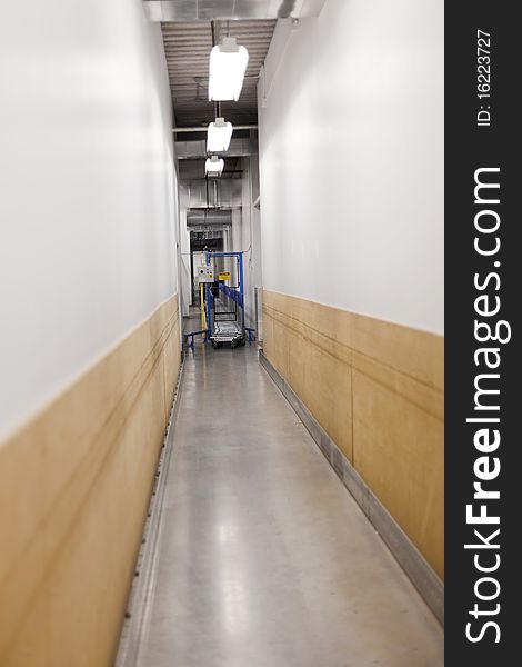 A view down a long corridor at the machine sorting shopping carts. A view down a long corridor at the machine sorting shopping carts