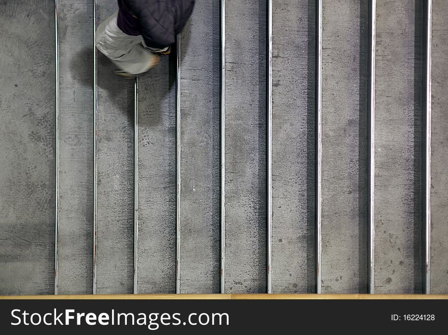 A shopper going down the steps