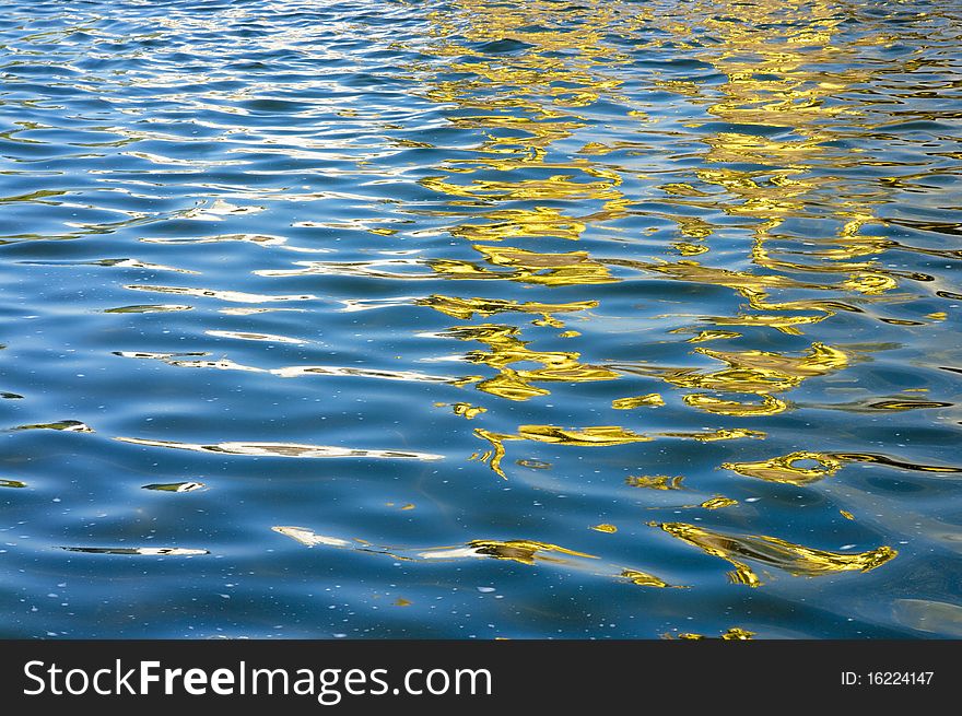 Water surface, the golden reflection