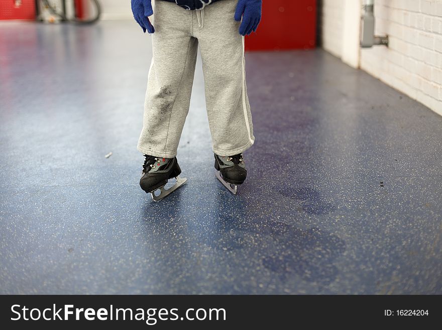 Little boy's legs after skating outside the rink. Little boy's legs after skating outside the rink