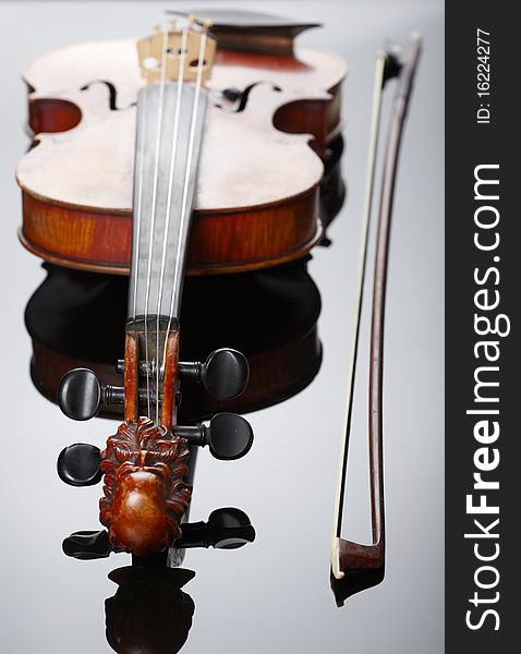 Violin and bow on dark background