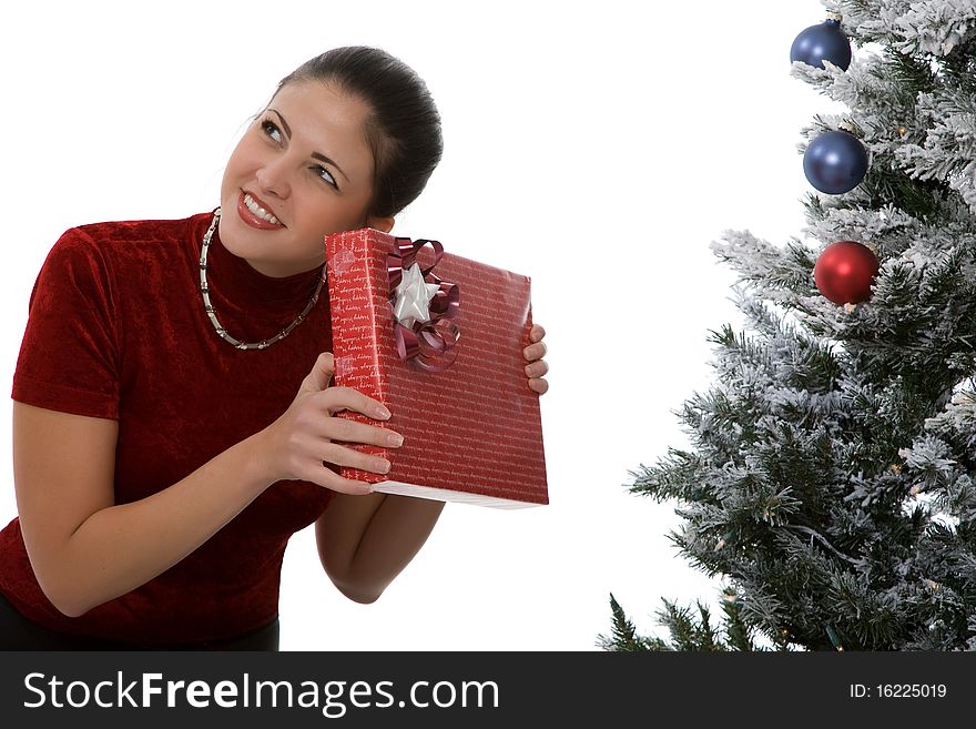 Woman with presents under Christmas tree. Woman with presents under Christmas tree.