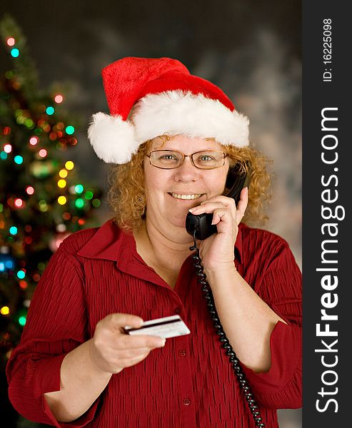 A grandma ordering holiday gifts over phone. A grandma ordering holiday gifts over phone