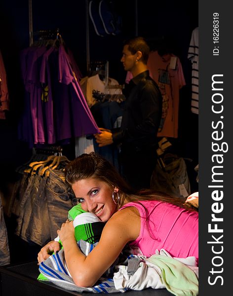 Smiling girl in dress store