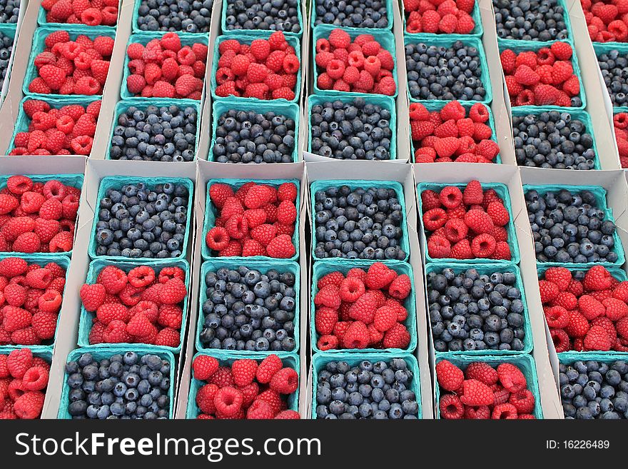 Farmers market,fresh organic blueberries and raspberry. Farmers market,fresh organic blueberries and raspberry