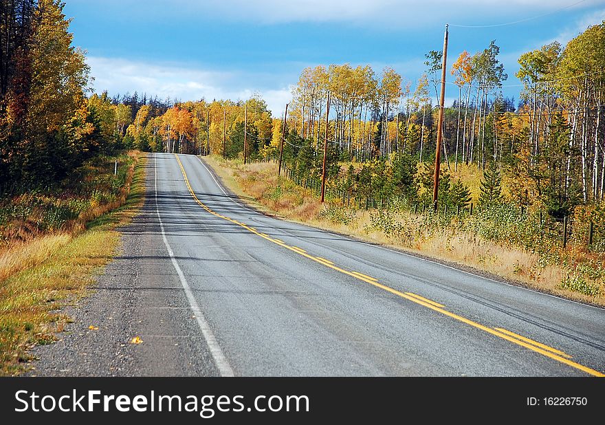 Highway running through colorful countryside in autumn. Highway running through colorful countryside in autumn